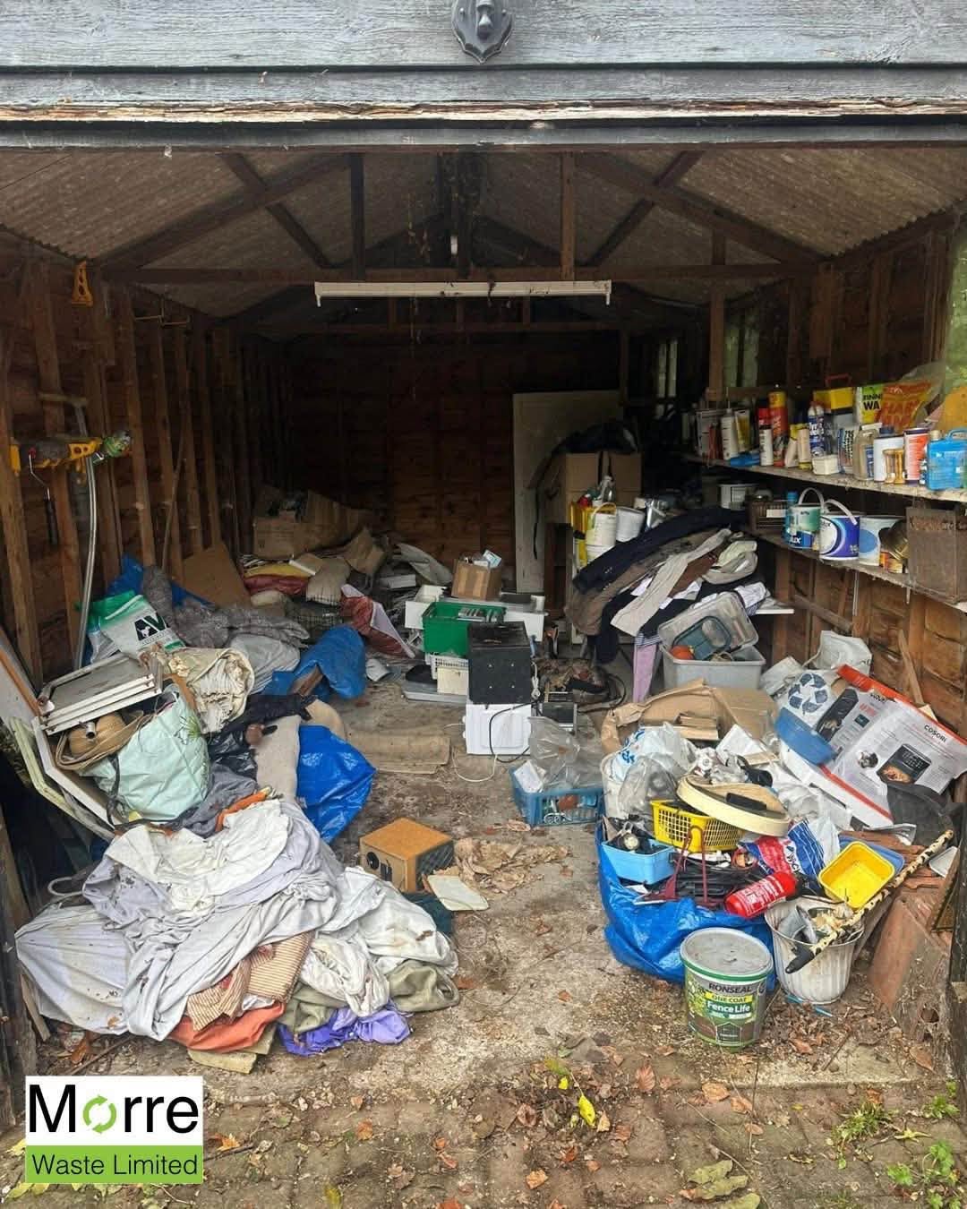 Garage before clearance, packed with junk